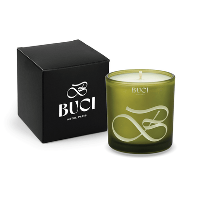 Green colored glass candle, 9 oz, shown alongside its matte black gift box
