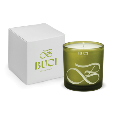 Green 9 oz. engraved colored glass candle paired with a white gift box.