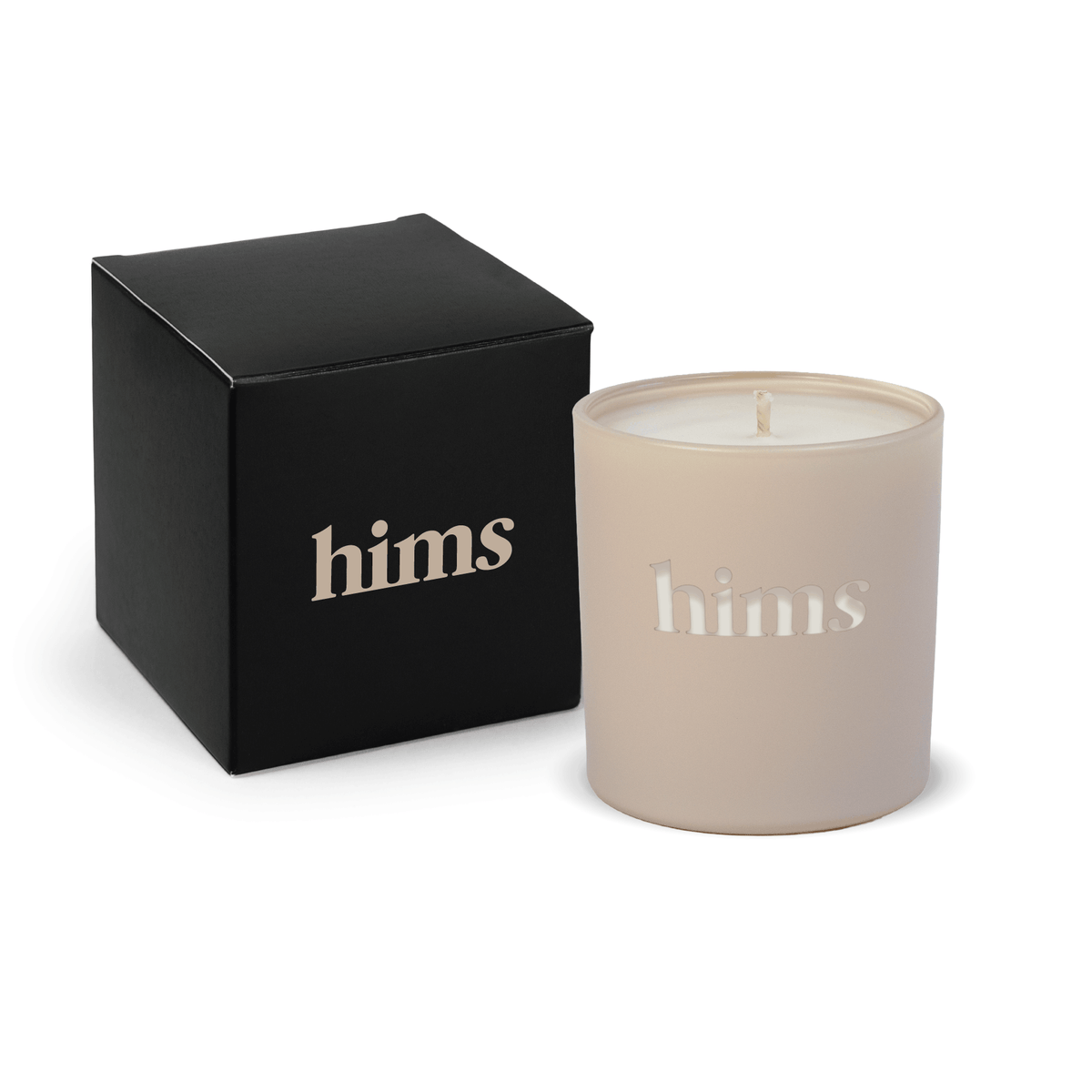 Nude 9 oz. engraved colored glass candle paired with a matte black gift box.