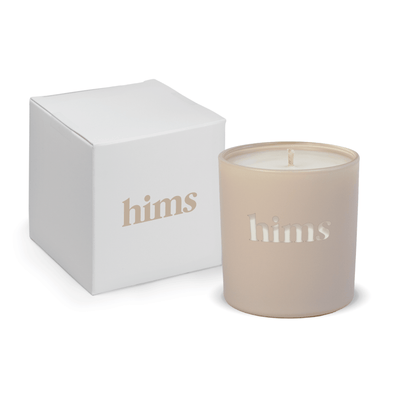 Nude 9 oz. engraved colored glass candle paired with a white gift box.