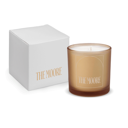 Sand 9 oz. engraved colored glass candle paired with a white gift box.