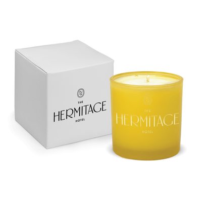 Yellow 9 oz. engraved colored glass candle paired with a white gift box.