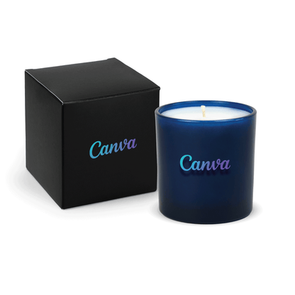 Blue 9 oz. printed colored glass candle paired with a matte black gift box.
