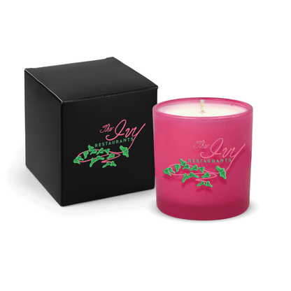 Pink 9 oz. printed colored glass candle paired with a matte black gift box.