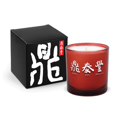 Red 9 oz. printed colored glass candle paired with a matte black gift box.