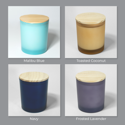 A selection of 4 different colors of glass vessels from Custom Candles LA. This selection shows the Malibu Blue, Toasted Coconut, Navy and Frosted Lavender vessels available.