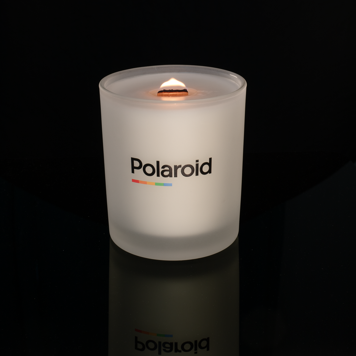 Satin Frosted 14 oz. Luxury Printed Candle lit, shown on a black background.