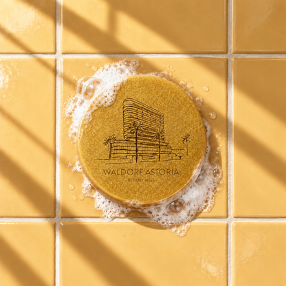 Gold round bar soap laser engraved with a brand logo, 3.6 oz, with soap bubbles