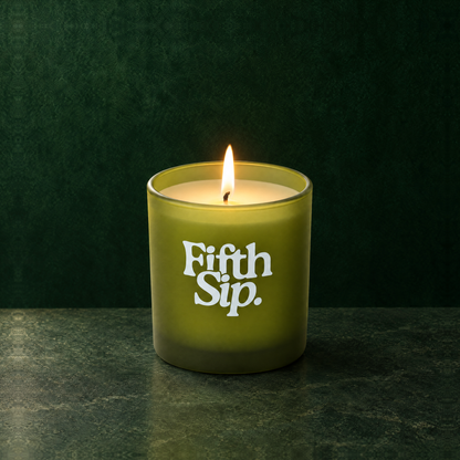 Green 9 oz. Classic Printed Candle lit with a printed custom logo, shown on a matching green background.