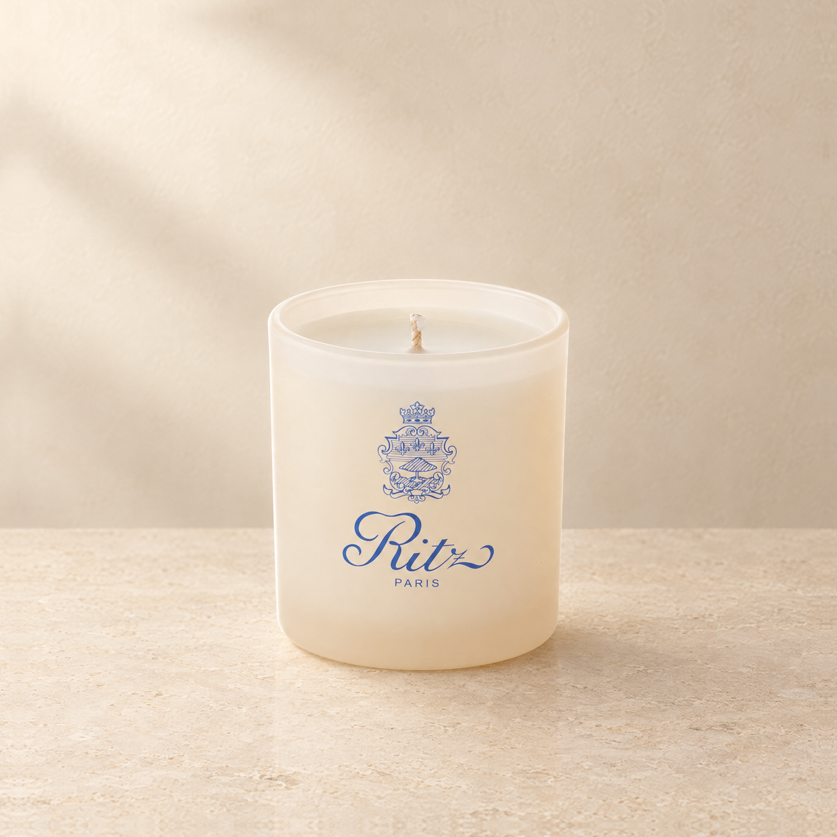 Ivory 9 oz. Classic Printed Candle with a custom printed logo, unlit.