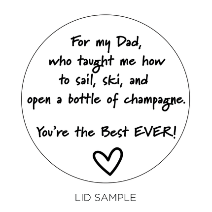 A sample of the wooden lid for the "Glad You're My Dad" Candle by Custom Candles L.A. features the message "For my Dad, who taught me how to sail, ski, and open a bottle of champagne. You're the best EVER!" followed by a heart.