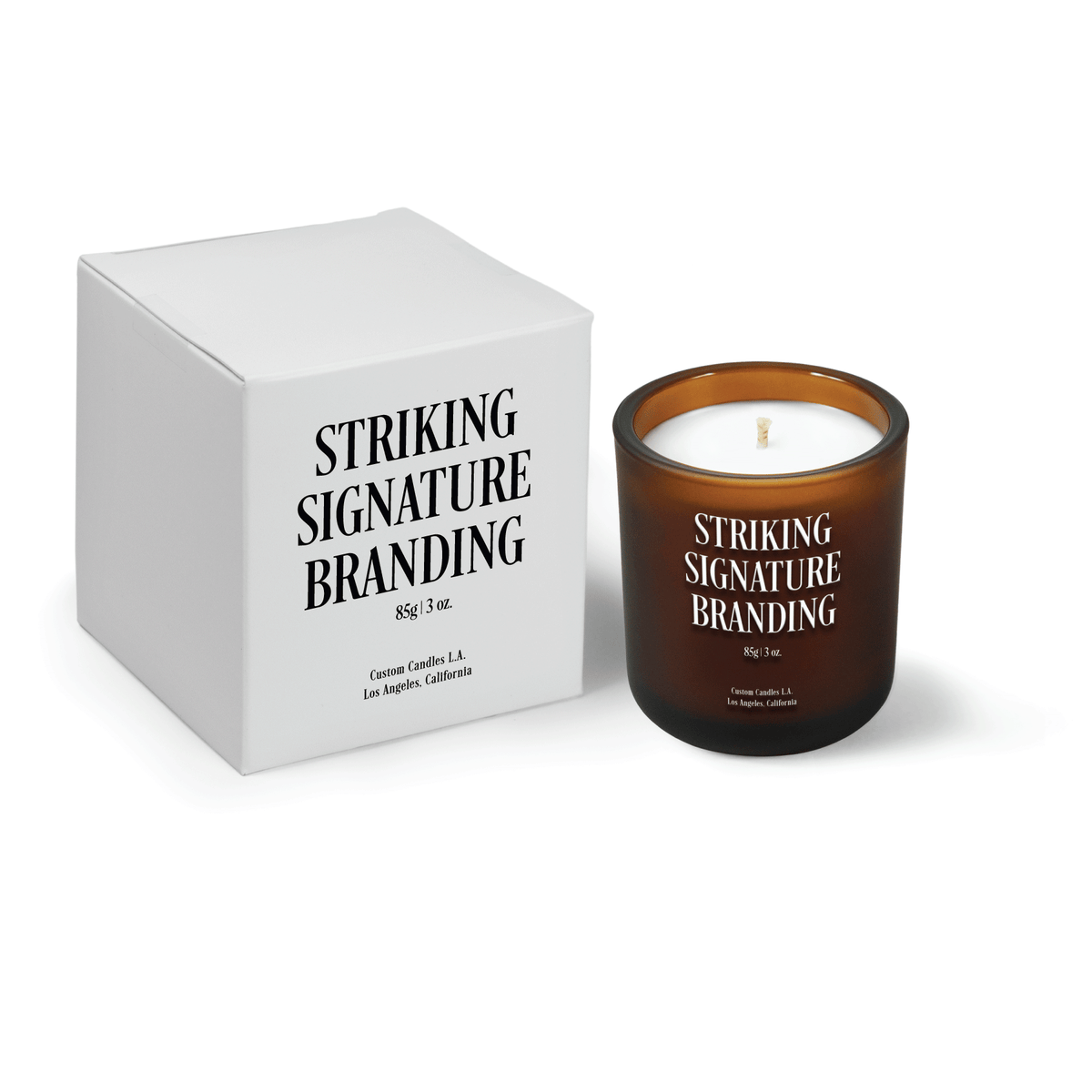 Amber frosted 3 oz Mini Signature candle, printed, shown beside its gift box.