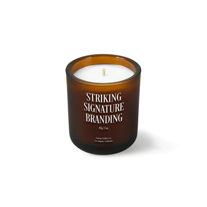 Amber frosted 3 oz Mini Signature candle with a printed custom logo, shown on its own.