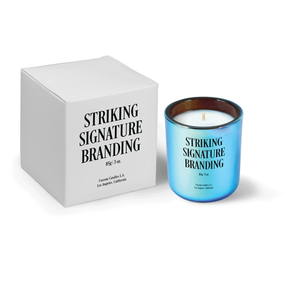 Chromatic blue 3 oz Mini Signature candle, printed, shown beside its gift box.