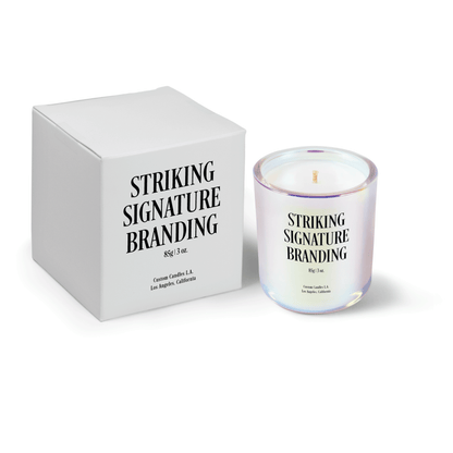 Iridescent pink 3 oz Mini Signature candle, printed, shown beside its gift box.