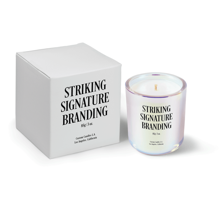 Iridescent pink 3 oz Mini Signature candle, printed, shown beside its gift box