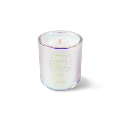 Iridescent pink 3 oz Mini Signature candle with a laser-engraved custom logo, shown on its own.