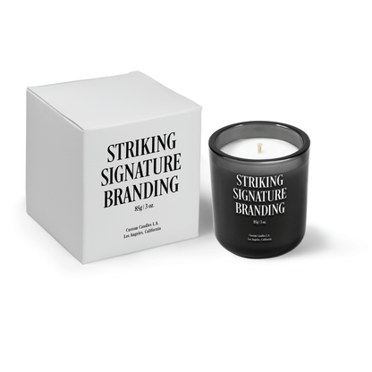 Charcoal gray 3 oz Mini Signature candle, printed, shown beside its gift box.