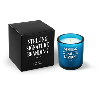Teal 3 oz Mini Signature candle, printed, shown beside its gift box.