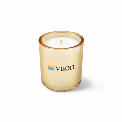 Glimmering gold 3 oz Mini Signature candle with a custom printed logo, shown on its own.
