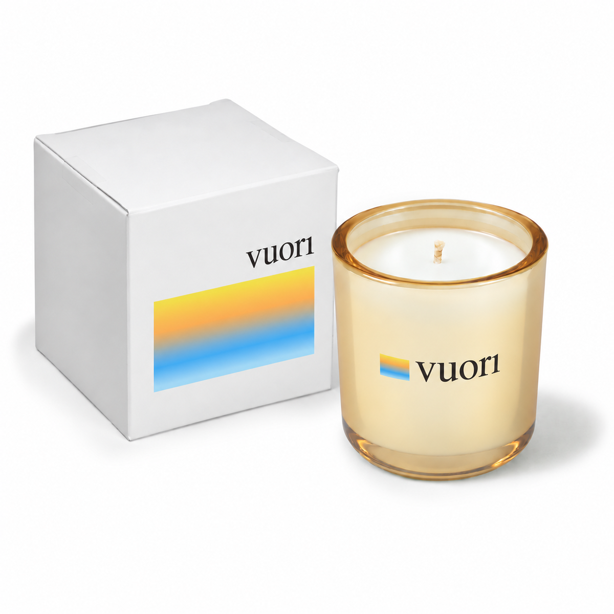 Glimmering gold 3 oz Mini Signature candle with a custom printed logo, shown beside its gift box.