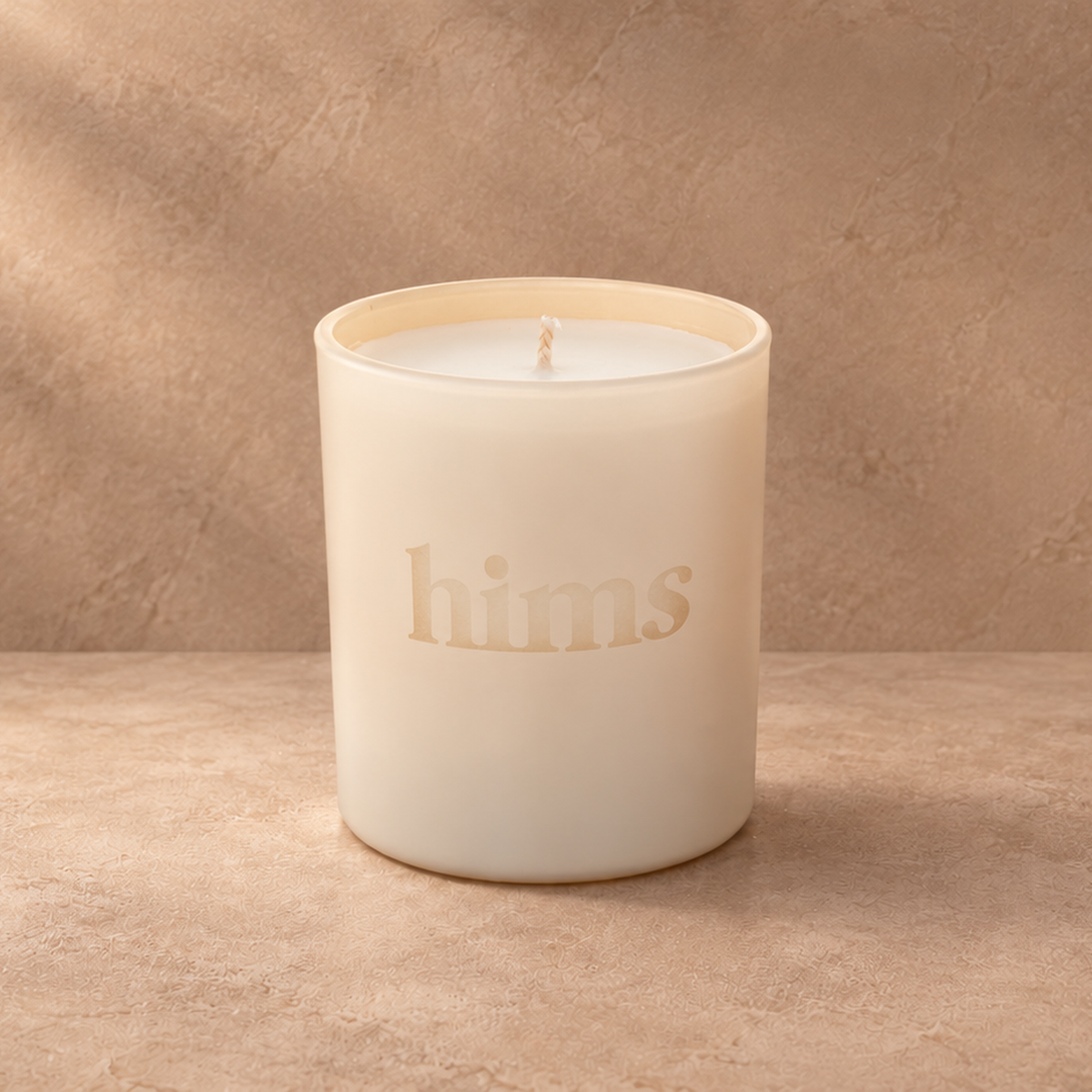 Nude 9 oz. Classic Engraved Candle with a custom engraved logo, unlit.