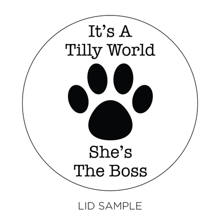 A sample of the wooden lid for the "Dog Photo" Candle by Custom Candles L.A. features the message "It's a Tilly World She's the Boss" accompanied by a paw print int the middle.