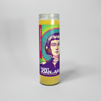 This image shows a 16 oz yellow prayer candle from Custom Candles LA. It features a vibrant illustration of Saint Joan of Arc with the text "Saint Joan of Arc" and "For those in need of courage" at the bottom.