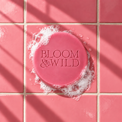 Pink round bar soap laser engraved with a brand logo, 3.6 oz, with soap bubbles