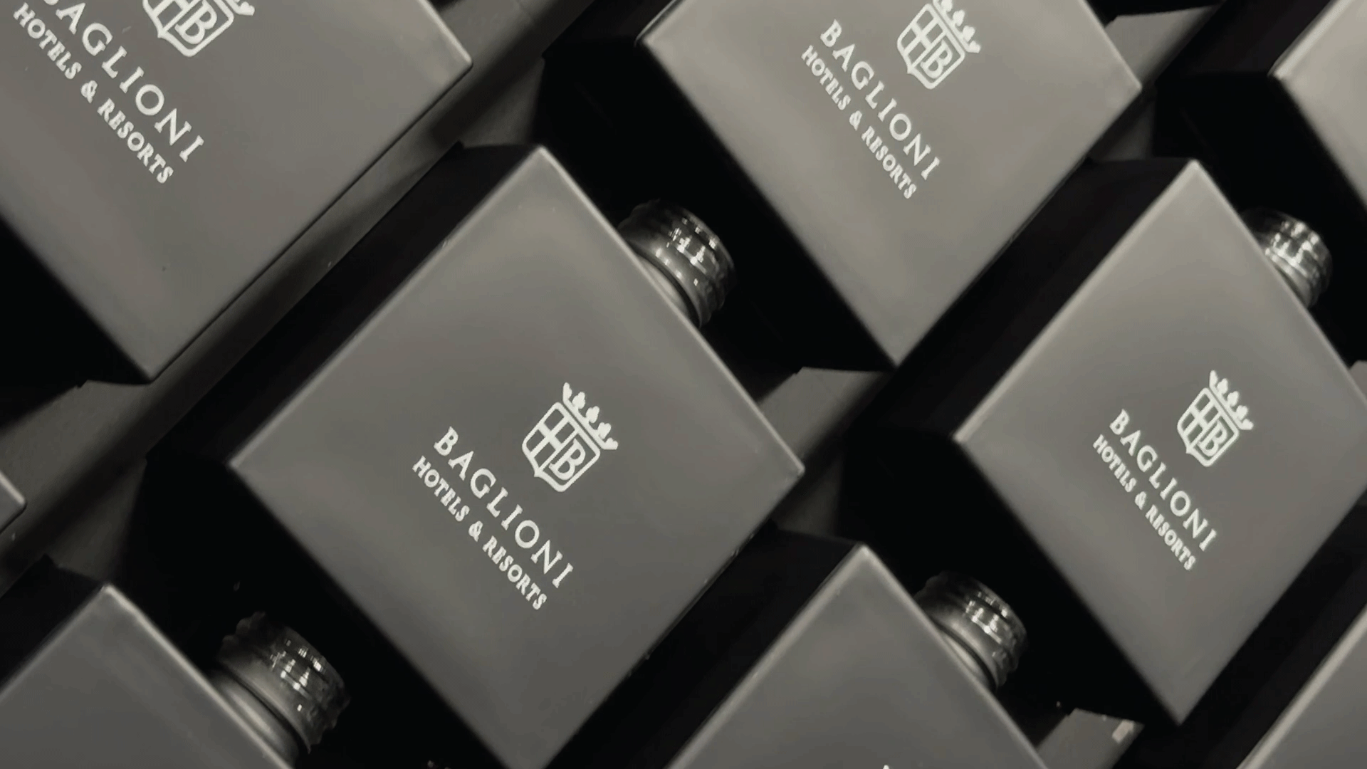 close up shot of black diffuser bottles with their elegant white branding at a shot from a very sharp camera angle