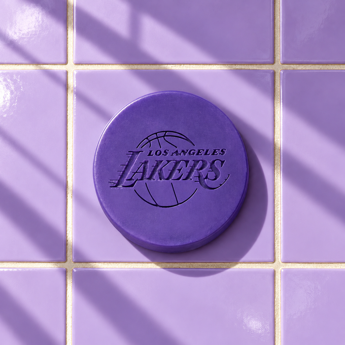 Purple round bar soap laser engraved with a brand logo, 3.6 oz