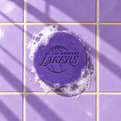 Purple round bar soap laser engraved with a brand logo, 3.6 oz, with soap bubbles