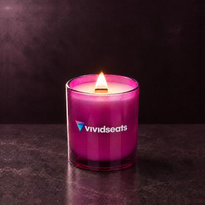 Purple 14 oz. Luxury Printed Candle lit with a printed custom logo, shown on a matching purple background.