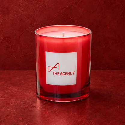 Red 9 oz. Classic Engraved Candle with a custom engraved logo, unlit.