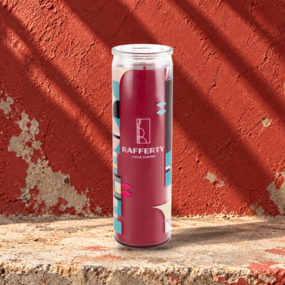 Red 16 oz custom prayer candle printed with the Rafferty logo on a red background, unlit