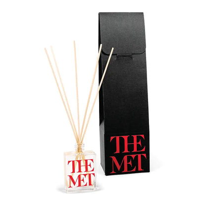 2.5oz clear Reed diffuser with printed branding with a black box on a white background