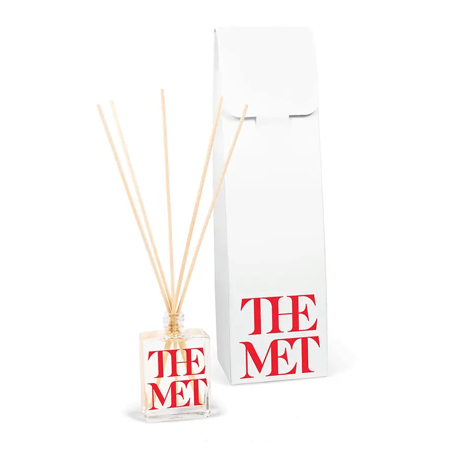 2.5oz clear Reed diffuser with printed branding with a white box on a white background