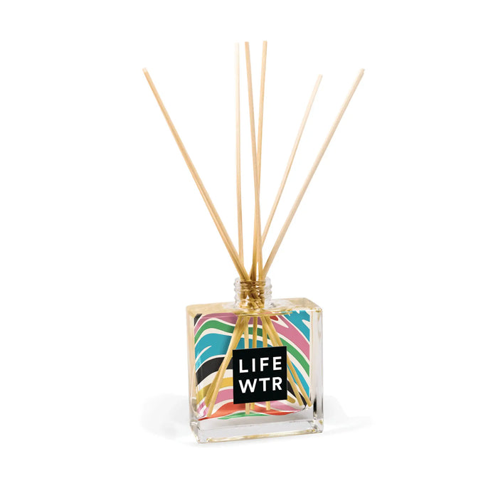Clear 8oz Reed Diffuser with sticks and branding on a white background
