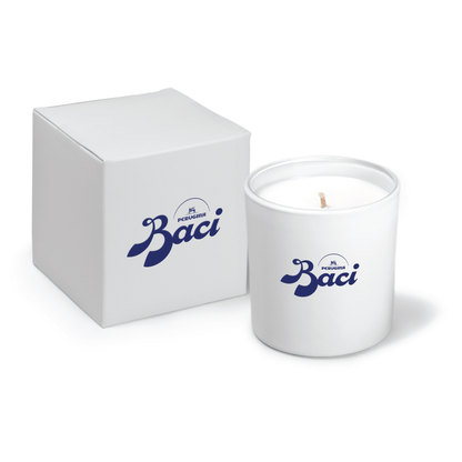 9 oz white glass candle with blue logo and white gift box with matching blue branding.