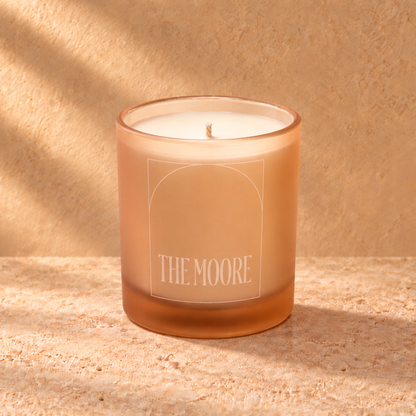 Sand 9 oz. Classic Engraved Candle with a custom engraved logo, unlit.