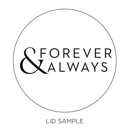 A sample of the wooden lid for the "Forever and Always" candle  by Custom Candles L.A. features the heartfelt message "Forever & Always" across the middle of the lid.