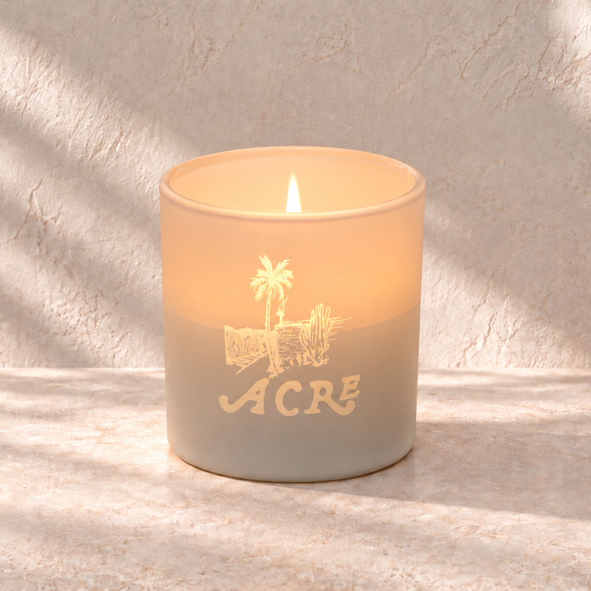 Matte White 9 oz. Classic Engraved Candle with a custom engraved logo, lit.