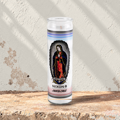White 16 oz custom prayer candle printed with the Nixon Santa Cruz logo on a white background, unlit