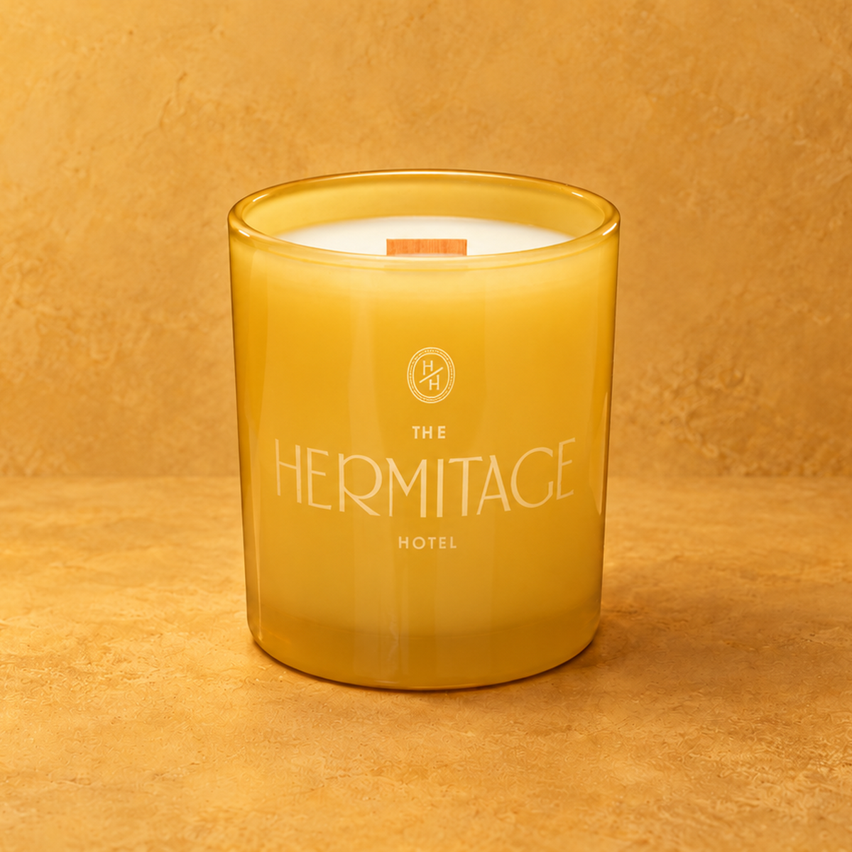 Yellow 14 oz. Luxury Engraved Candle with a custom engraved logo, unlit.