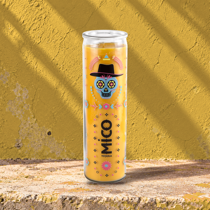 Yellow 16 oz custom prayer candle printed with the Mico Tequila logo on a yellow background, unlit