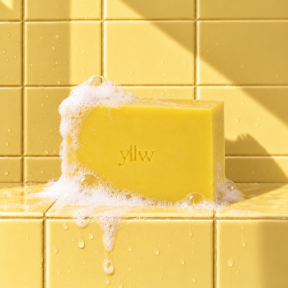 Yellow rectangle bar soap laser engraved with a brand logo, 3.25 oz, with soap bubbles