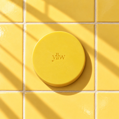 Yellow round bar soap laser engraved with a brand logo, 3.6 oz