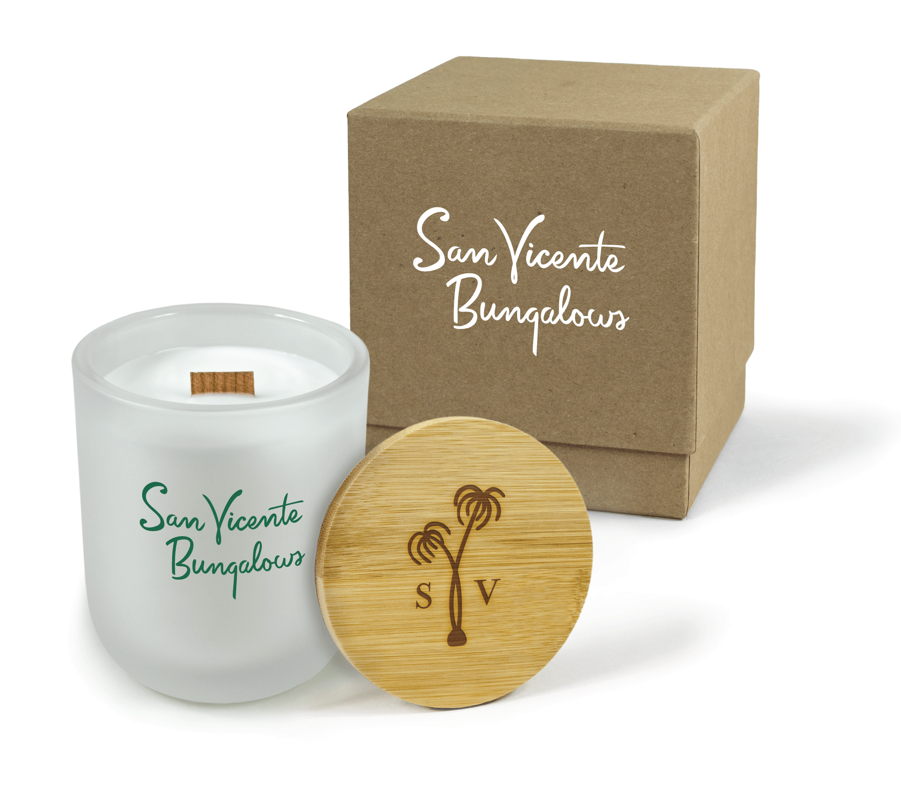 
A 12 oz Luxe Custom Candle in the color “Cashmere” which is a diffused white from Custom Candles LA. The candle features a wood wick and 4-color green printed logo for “San Vicente Bungalows” on the front of the glass. Leaning against the side of the candle is a bamboo candle lid etched with a palm tree and “S” and “V”. In the background, there is a kraft 2-piece box printed with a white logo for “San Vicente Bungalows”.