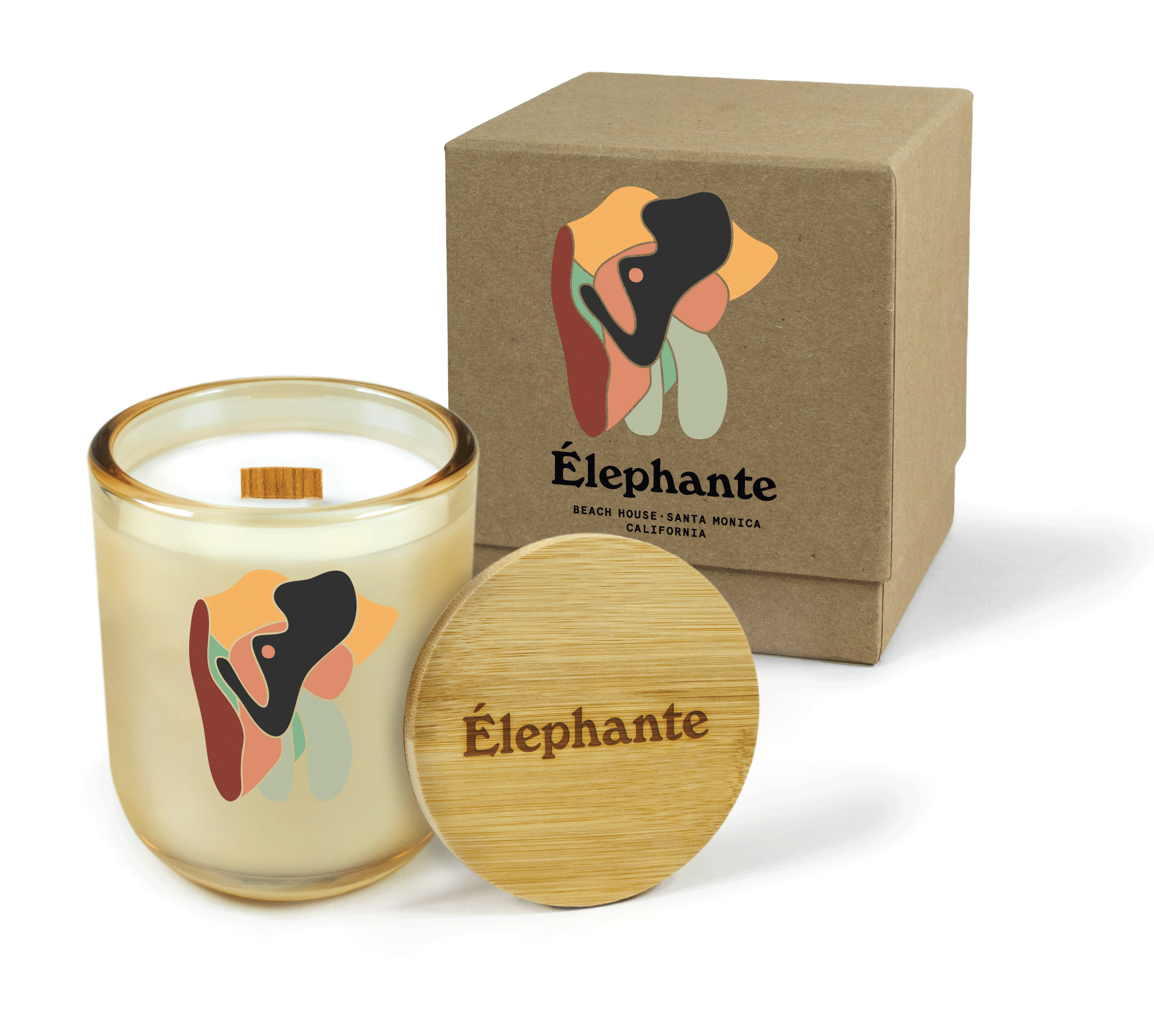 
A 12 oz Luxe Custom Candle in the color “Daybreak” which is a glimmering gold from Custom Candles LA. The candle features a wood wick and a colorful abstract elephant logo 4-color printed on the front of the glass. Leaning against the side of the candle is a bamboo candle lid engraved with the “Elephante” logo. In the background, there is a kraft 2-piece box printed with a colorful abstract elephant and “Elephante Beach House • Santa Monica California”.