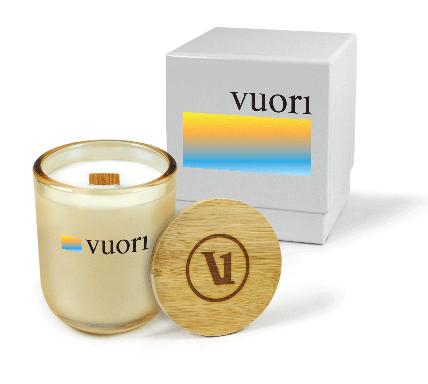 A 12 oz Luxe Custom Candle in the color “Daybreak” which is a glimmering gold from Custom Candles LA. The candle features a wood wick and a 4-color “Vouri” logo on the front of the glass. Leaning against the side of the candle is a bamboo candle lid engraved with a “V” icon logo. In the background, there is a white 2-piece box 4-color printed with “Vouri” logo and a yellow to blue gradient rectangle.